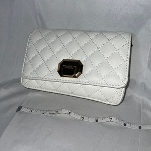 New. Aldo white purse. Never used.